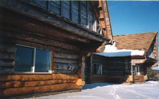 Log house in Winter.